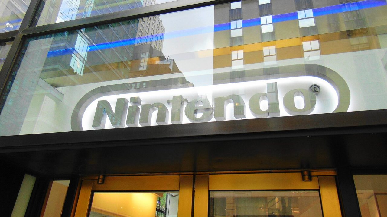 Nintendo logo sign on the glass storefront of Nintendo New York