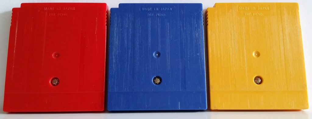 Backs of the European Game Boy cartridges of Pokémon Red, Blue and Yellow