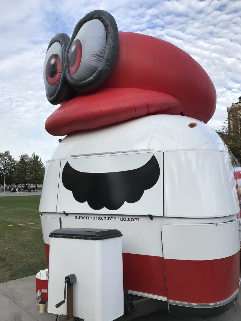 Super Mario Odyssey promotional road trip trailer decorated with game artwork