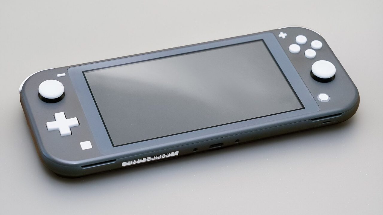 Grey Nintendo Switch Lite handheld console on a plain background